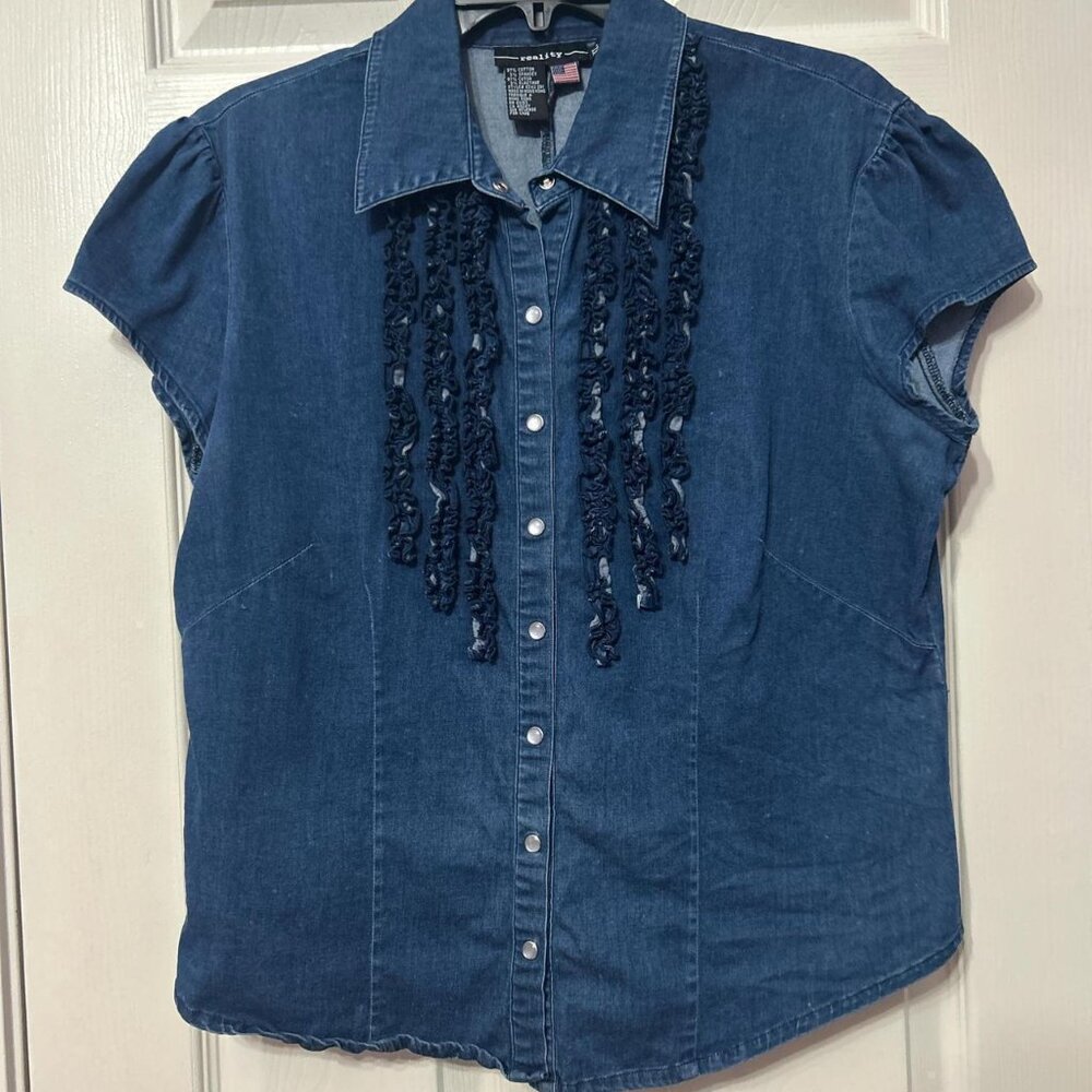 Blue denim blouse with ruffled trim